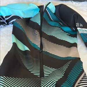 Spyder Nine Ninety Women’s Black and Teal Ski race suit -Size Large